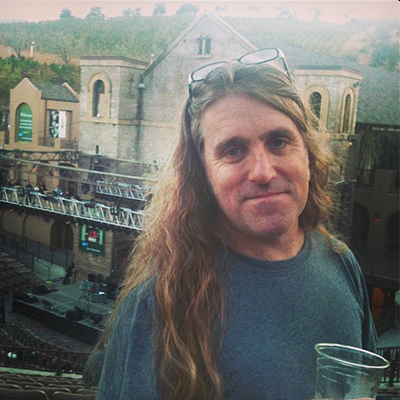 Kenny outside drinking beer